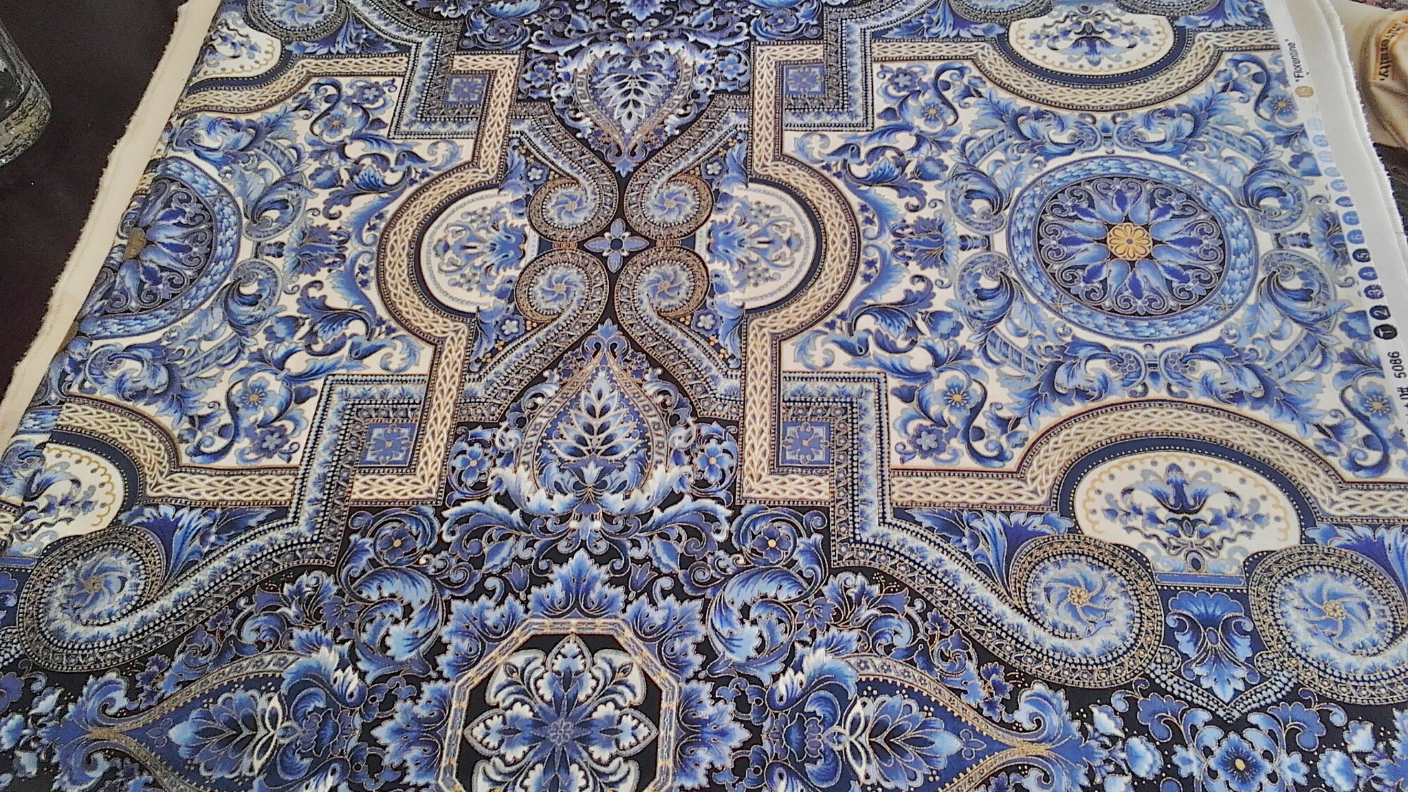 Blue and gold ornate printed fabric