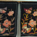 Two finished Sri Lankan batik panels with butterflies and flowers on black